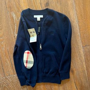 Kids Burberry zip-up sweater.